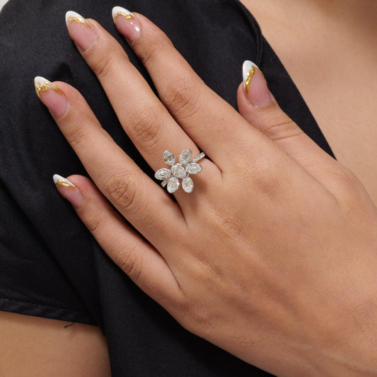 Overhead view of the flower head — channel-set baguette diamonds framed by pavé rounds
