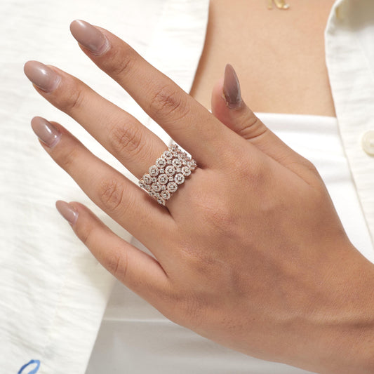 Worn on the hand — wide 14K gold three row diamond ring sitting across the finger