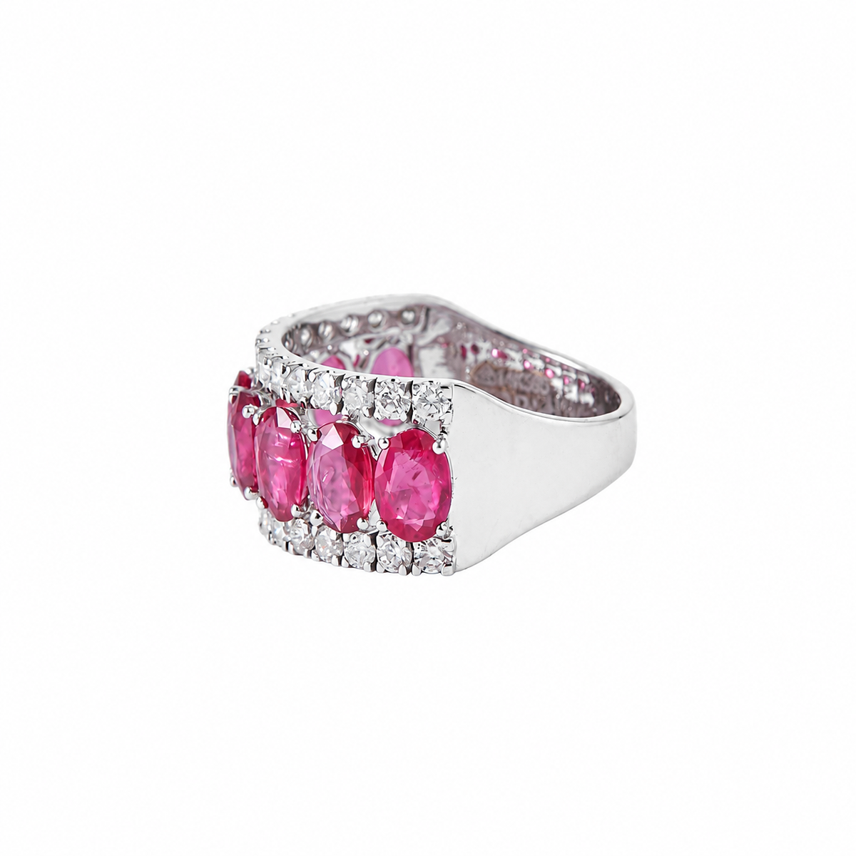 Close-up of the prong-set oval rubies on the 14K white gold ring with pavé natural diamonds