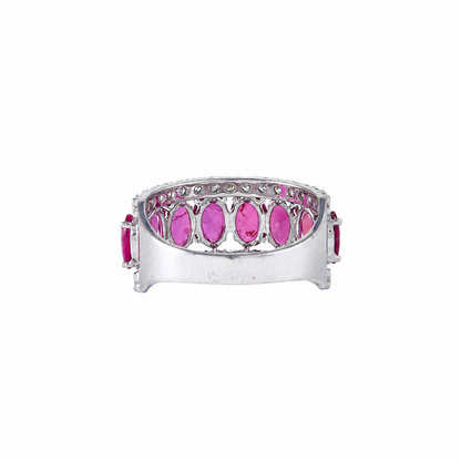 Angled view of the open gallery on the 14K white gold ruby and diamond wide band ring