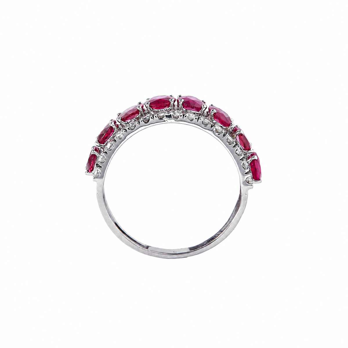 Worn on the hand — 14K white gold band ring with oval natural rubies and diamonds