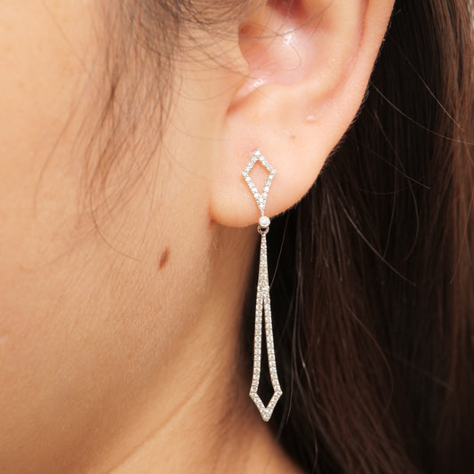 Geometric diamond drop earrings in 14K white gold, seen from the side.