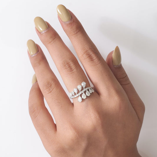 Overhead view of the mirrored pear rows — 14K white gold ring with pavé centre line