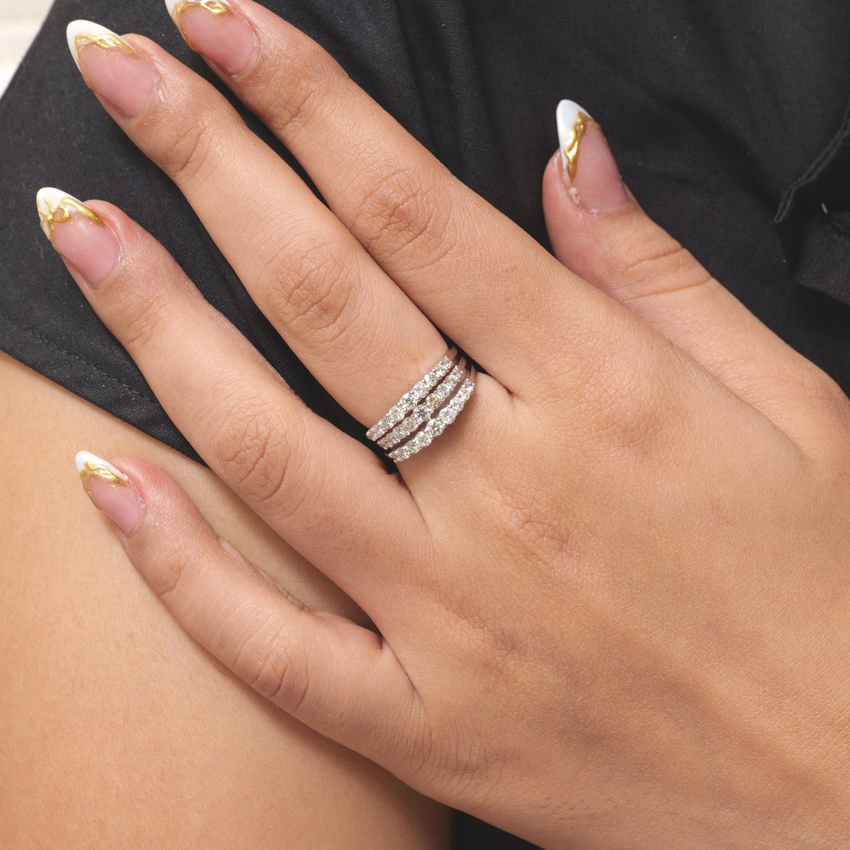 Triple row pavé natural diamond band ring in 14K white gold, seen from the side showing the split shank.