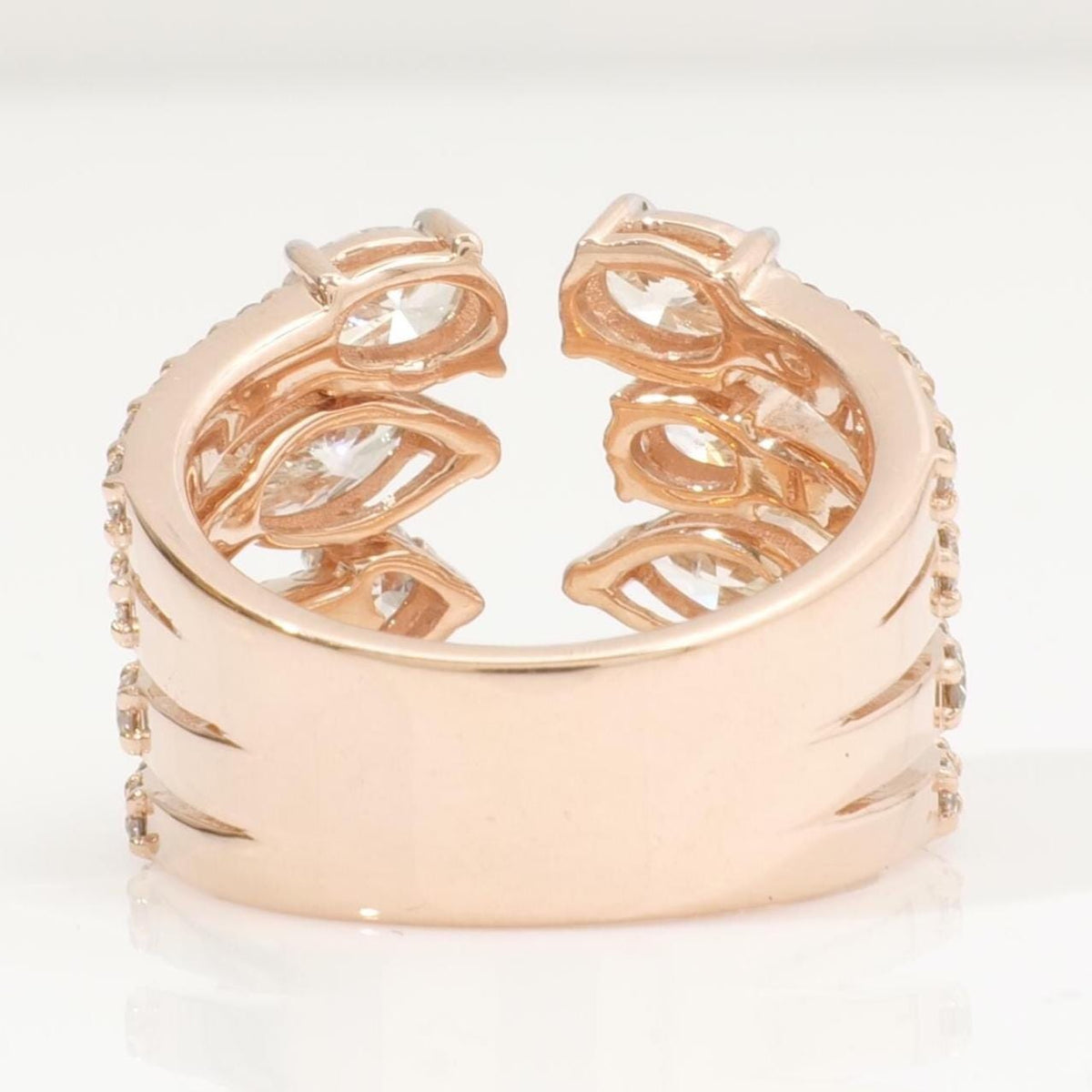 Held in hand showing the width of the 14K yellow gold band and its pavé diamond rows