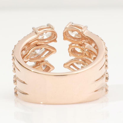 Held in hand showing the width of the 14K yellow gold band and its pavé diamond rows