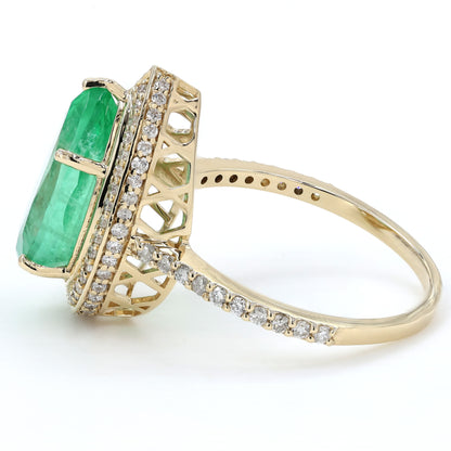 Angled view of the split shank — 14K yellow gold emerald ring with pavé-set natural diamonds
