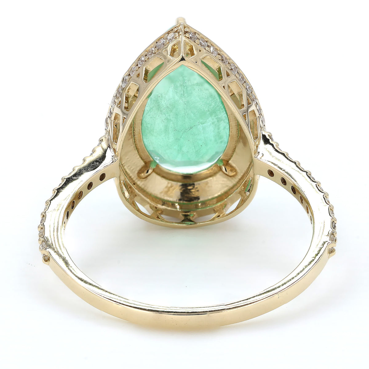 Side profile of the open gallery — 14K yellow gold ring lifting the pear emerald above the band