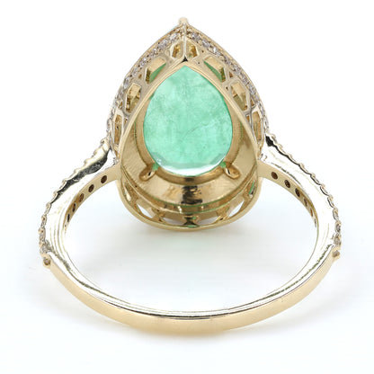 Side profile of the open gallery — 14K yellow gold ring lifting the pear emerald above the band