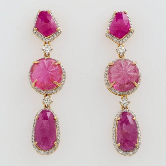 Natural ruby and rubellite three tier drop earrings with diamond halos in 14K yellow gold.