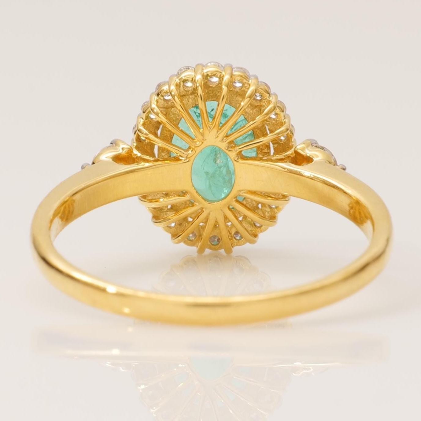 Oval Emerald Halo Diamond Ring