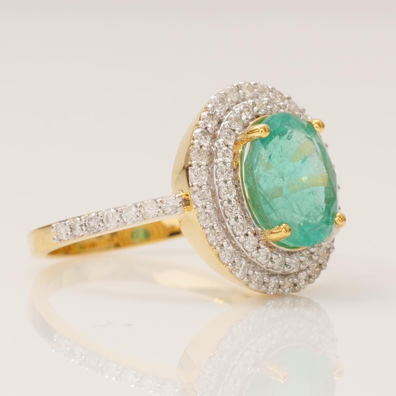 Oval Emerald Double Halo Diamond Ring