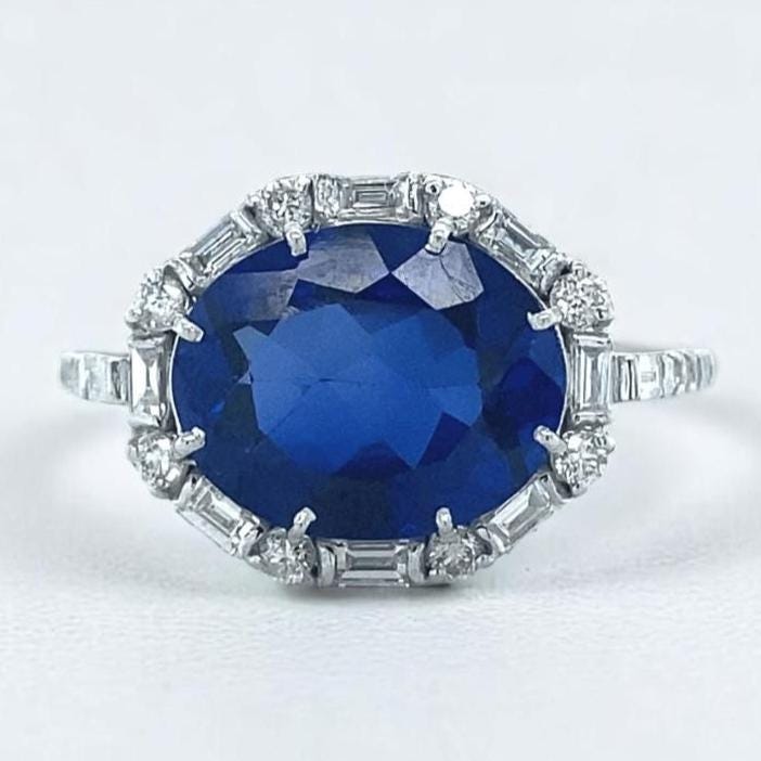 Oval Blue Sapphire Diamond Halo Ring