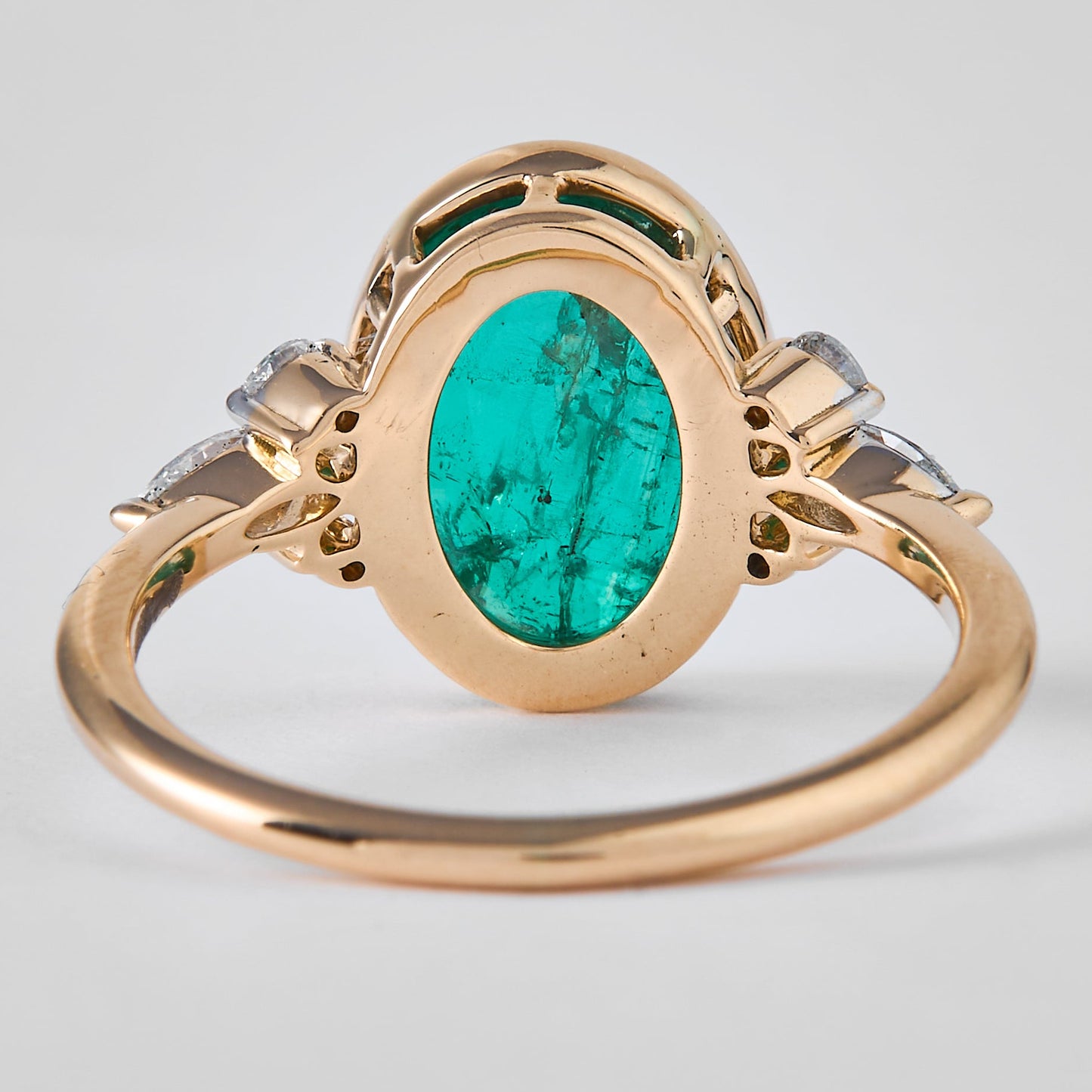 Oval Emerald Halo Diamond Ring